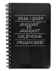 A black spiral-bound 2026-2027 August to August calendar organizer with silver handwritten-style text on the cover, shown on a plain white background.