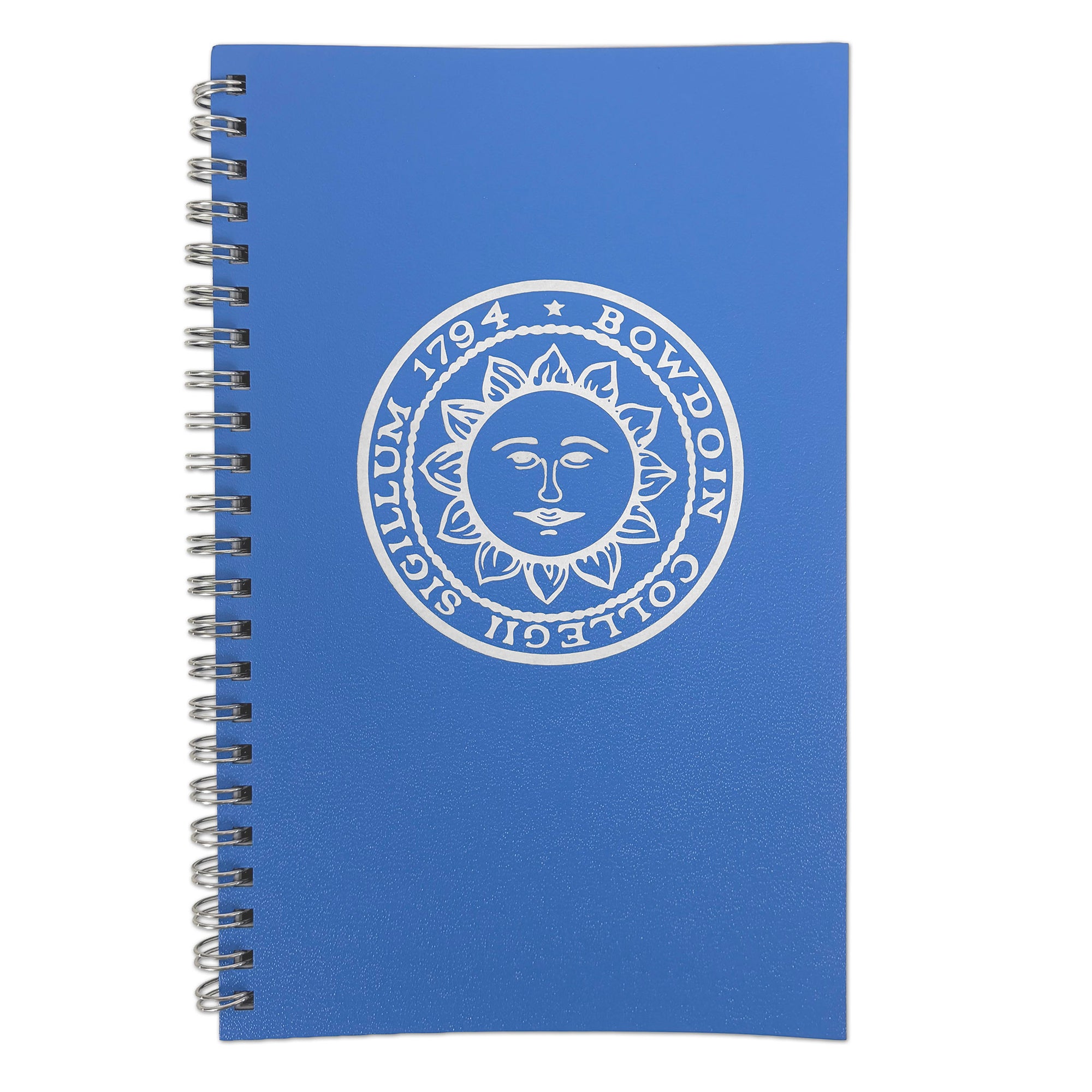 A blue spiral-bound notebook featuring a white printed circular seal with a sun face and the text 'BOWDOIN COLLEGII SIGILLUM 1794' on the cover, shown against a plain white background.