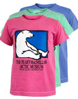 Pink t-shirt with a polar bear graphic and text, displayed with other colored shirts on a white background.