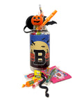 A Halloween-themed water bottle with a clear plastic body, a blue and black label featuring a large letter 'B', and a jack-o'-lantern decoration on top. The jar is filled with colorful candies and surrounded by assorted sweets on a white background.
