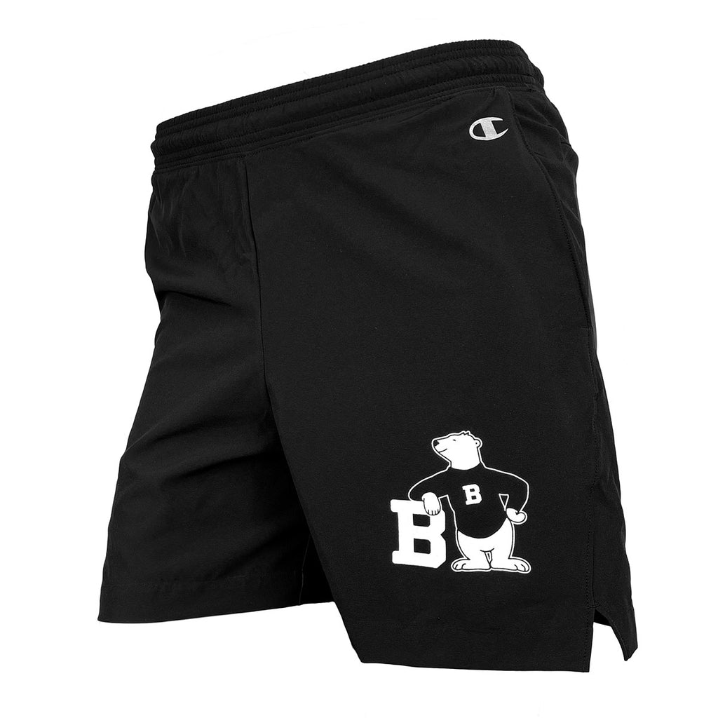 Black shorts with white imprint of cartoon bear on left leg.