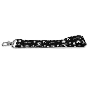 Key tag with claw clasp and black ribbon strap with all-over imprint of mascot medallions, Bs, and arched BOWDOINs.