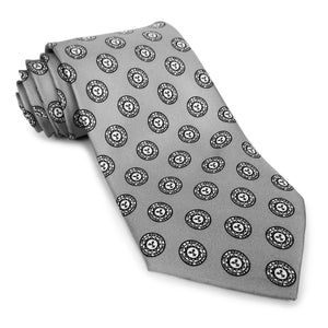 Cool grey necktie with repeating all-over Bowdoin College sun seal design.