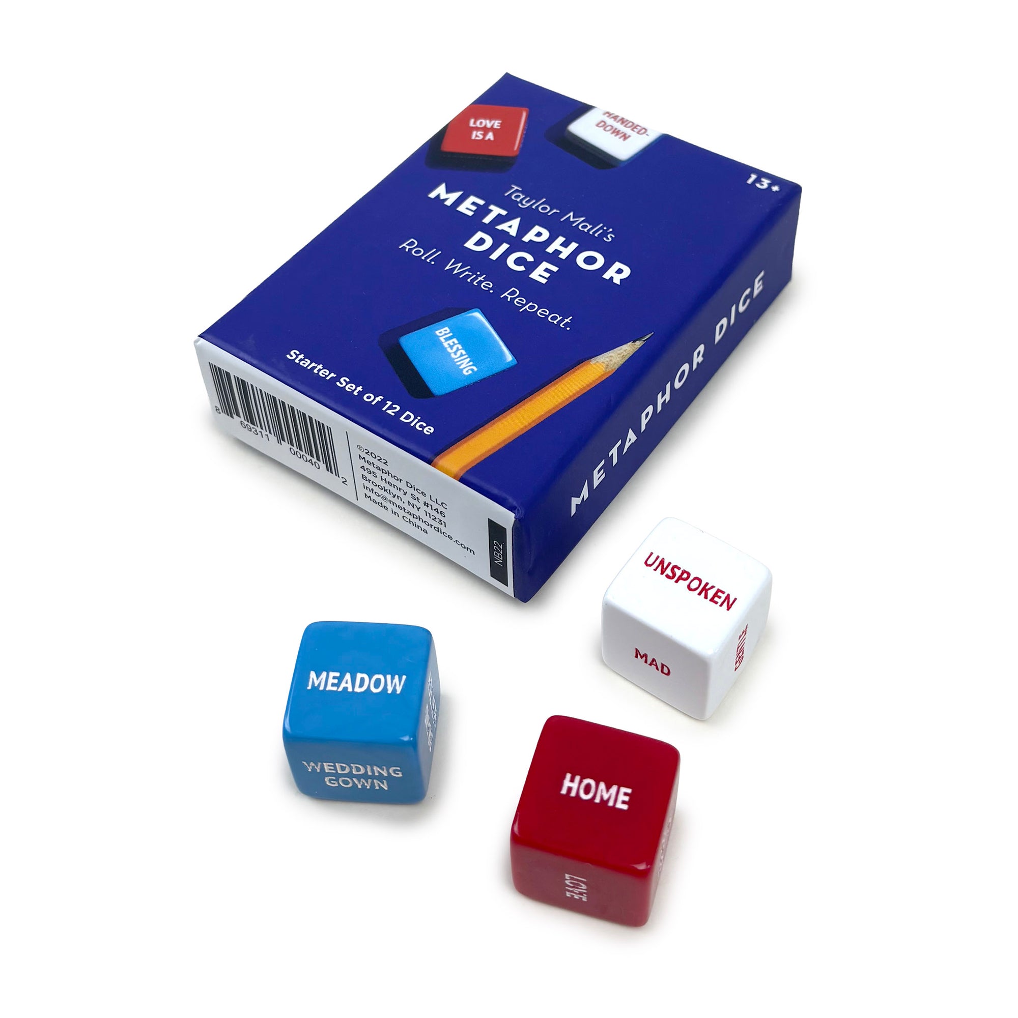 Taylor Made's Metaphor Dice packaging with dice showing text on a white background