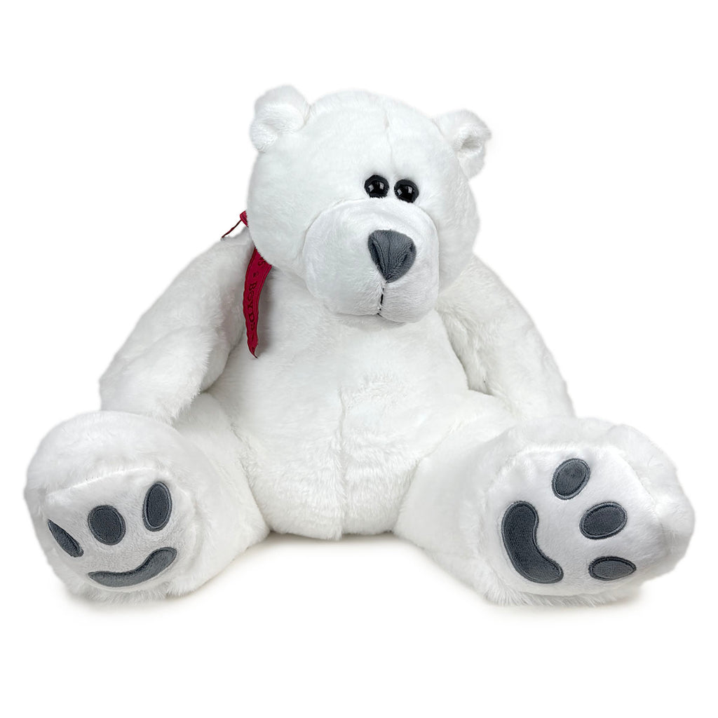 Slouchy white teddy bear with round black eyes and a grey nose and paw pads, with a red ribbon around its neck.