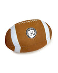 Brown and white football-shaped toy with a bear logo on a white background