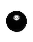 Black stuffed hockey puck with a white bear logo on a white background