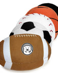 Set of five sports-themed stuffed toys including a football, soccer ball, basketball, baseball, and hockey puck on a white background.