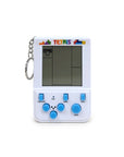 Tetris electronic game keychain with screen and buttons on a white background