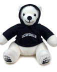 White teddy bear wearing a black hoodie with 'Bowdoin' printed on it against a white background. The hood is pulled up over the bear's head and its ears are sticking out of holes in the hood.