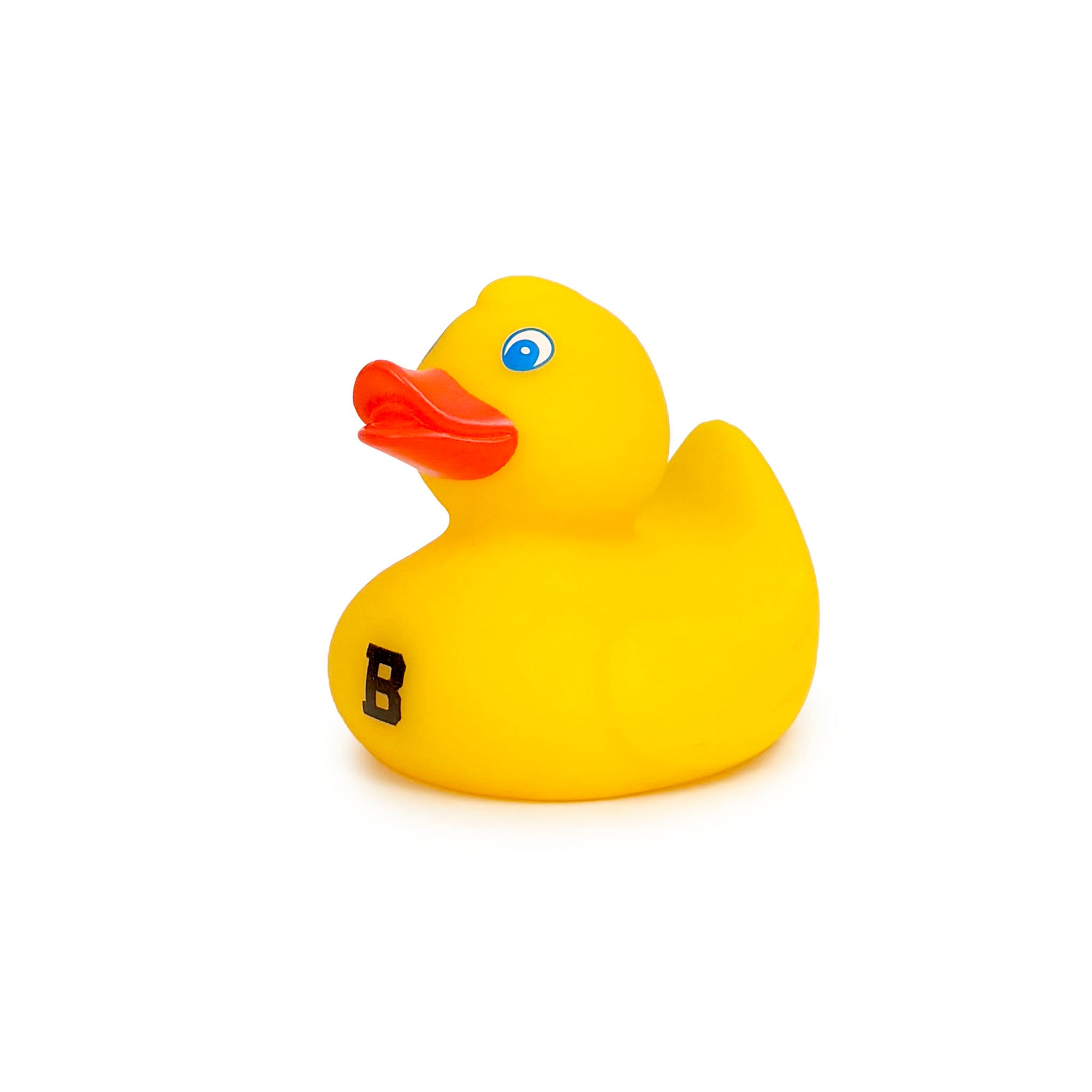 A classic yellow rubber duck toy with a bright orange beak, blue eyes, and a black letter 'B' printed on its side, shown against a plain white background.