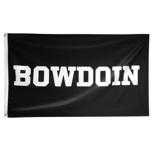 Black flag with white edge, brass grommets, and white imprint of BOWDOIN