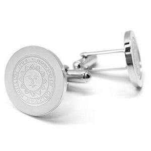 Silver cufflinks with engraved Bowdoin College seal.
