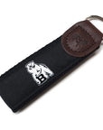 Black web key fob with leather cap and black silk ribbon with woven white polar bear mascot.