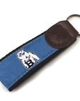 Black web key fob with leather cap and blue silk ribbon with woven white polar bear mascot.