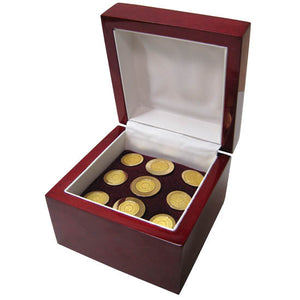 Red wooden presentation box with 9 brass blazer buttons engraved with the Bowdoin College sun seal.
