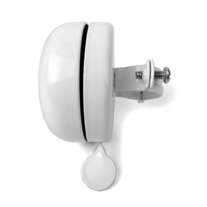Side view of white bike bell.