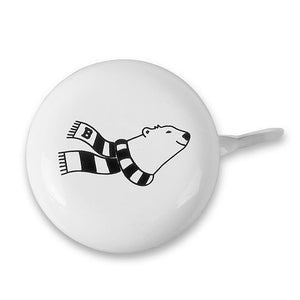 Round white bike bell with imprint of Bowdoin spirit bear wearing a black and white striped scarf.
