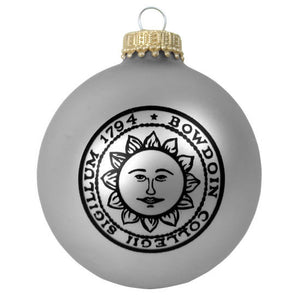 Matte silver glass ball ornament with black Bowdoin sun seal imprint.