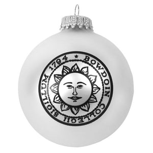 Matte white glass ball ornament with black Bowdoin sun seal imprint.