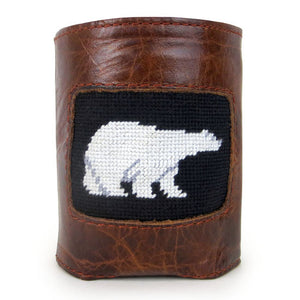 Leather can cooler with needlepoint inset of white polar bear in black ground.