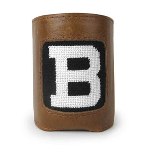 Leather can cooler with needlepoint inset of large white B in black ground.