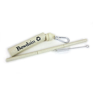 Natural oat colored straw case with black Bowdoin imprint and silver carabiner, 3-section natural colored straw, and small cleaning brush tool.