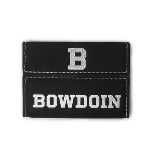 Black leather business card case with silver imprint of B on flap and BOWDOIN on body. Silver contrast stitching.