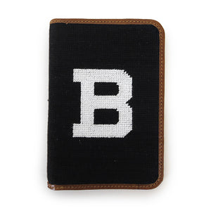 Leather golf scorecard holder with needlepointed cover of whit B on black background.