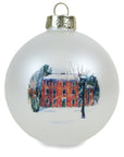 Pearl white bulb ornament with print of painting of Mass Hall in the snow.