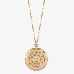 Round gold pendant with engraved Bowdoin sun seal, surrounded by 7 small diamonds on the compass points, and a diamond-studded bail representing north.