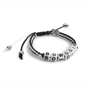 Black and white braided adjustable bracelet with letter beads that spell BOWDOIN