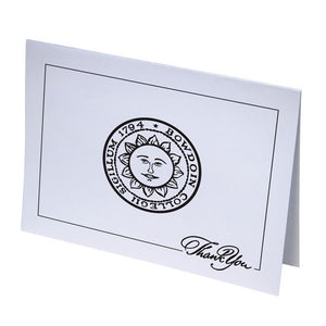White notecard with horizontal layout. Black imprint of Bowdoin sun seal and border interrupted by THANK YOU in fancy script in the lower right corner.