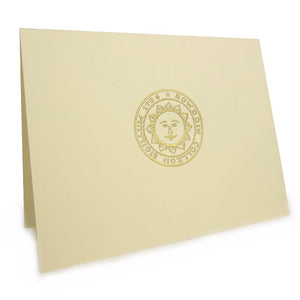 Embossed natural color notecard with gold embossed seal.