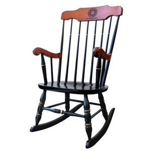 Black rocking chair with gold details and stained maple arms and top.