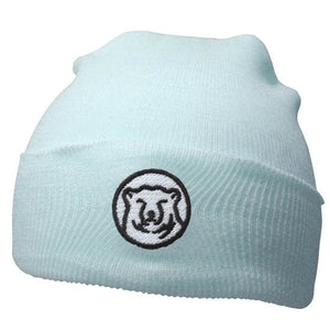 Baby blue knit baby hat with embroidered mascot medallion patch on turned-up cuff.