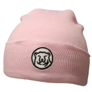 Baby pink knit baby hat with embroidered mascot medallion patch on turned-up cuff.