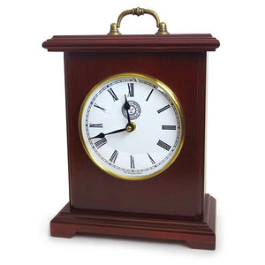 Simple bracket style mantel clock in burgundy finish with brass handle on top. Clock face is white with Roman numeral hour markers and a small Bowdoin seal under XII.