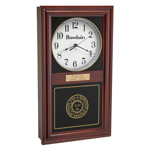 Burgundy finish wall clock with clock face in upper inset in white with a Bowdoin wordmark and Arabic numerals, and a Bowdoin College seal in gold on the lower glass. Optional brass engraved plaque is shown on midrail.