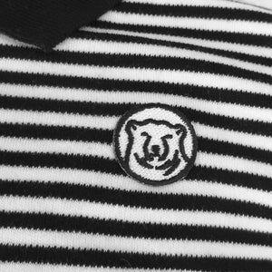 Closeup detail showing embroidered polar bear medallion.