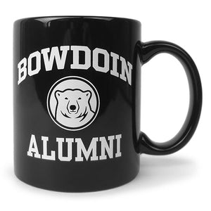 Black coffee mug with white imprint of BOWDOIN arched over a polar bear medallion over the word ALUMNI.