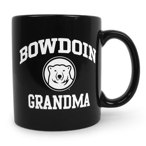 Black coffee mug with white imprint of BOWDOIN arched over a polar bear medallion over the word GRANDMA.