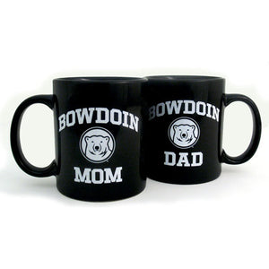 Two black coffee mugs side by side, one with BOWDOIN MOM imprint, the other with BOWDOIN DAD.