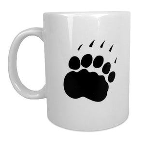 White coffee mug showing reverse side with black paw print.