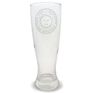 Clear pilsner glass with engraved Bowdoin College sun seal