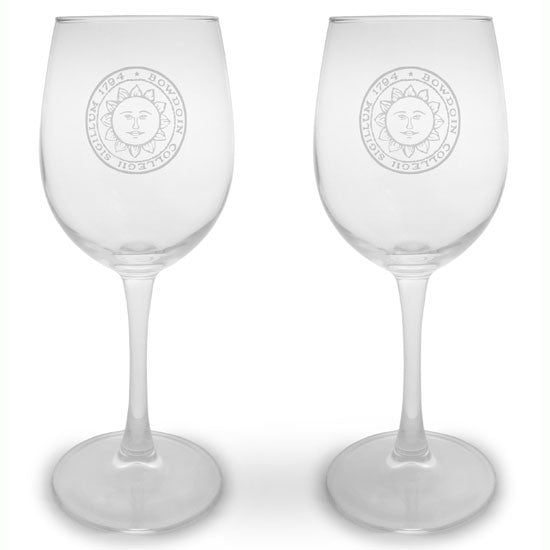 Pair of clear stemmed wine glasses with engraved Bowdoin College seal on each