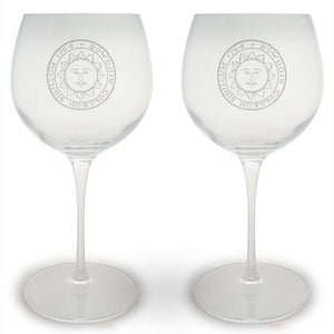 Set of two round stemmed wineglasses with engraved BOWDOIN college seal on each.
