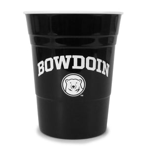 Black plastic party cup with white interior and white imprint of BOWDOIN arched over mascot medallion.