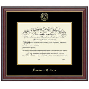 Mahogany-finish diploma frame with gold fillet and black and gold matting. Gold embossed Bowdoin College seal at the top of the mat, gold BOWDOIN COLLEGE in Old English text at the bottom.