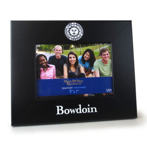 Black picture frame in horizontal layout with Bowdoin seal imprint on top of frame, and BOWDOIN on the bottom of the frame.